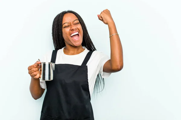 Young African American Barista Woman Isolated Blue Background Raising Fist — Stock Photo, Image