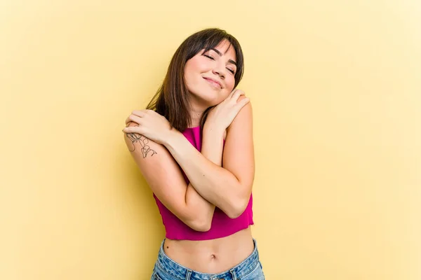 Young Caucasian Woman Isolated Yellow Background Hugs Smiling Carefree Happy — Stock Photo, Image