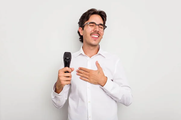 Young Hispanic Singer Man Isolated White Background Laughs Out Loudly — Stock Photo, Image