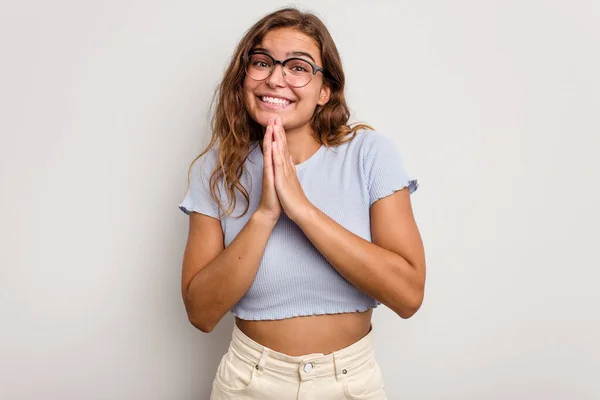 Young Caucasian Woman Isolated Blue Background Holding Hands Pray Mouth — Stock Photo, Image