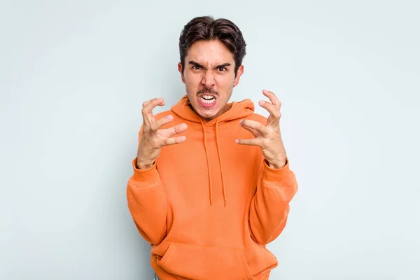 Young Hispanic Man Isolated Blue Background Upset Screaming Tense Hands — стоковое фото