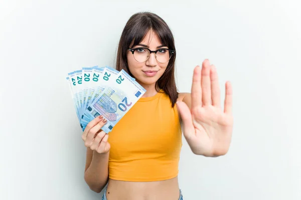 Young Caucasian Woman Holding Banknotes Isolated Blue Background Standing Outstretched — Stock Photo, Image