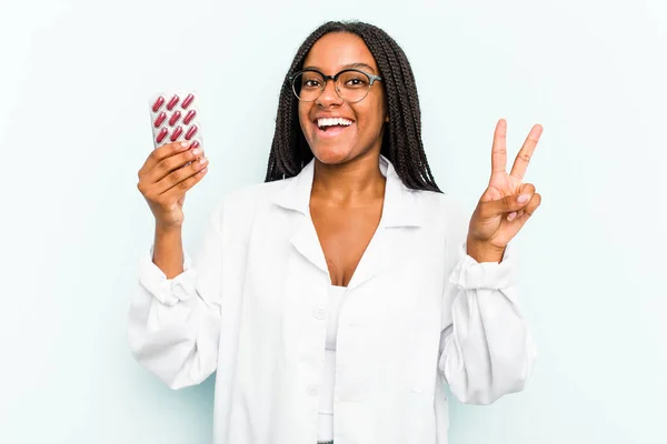 Young African American Pharmacist Woman Isolated Blue Background Joyful Carefree — Stock Photo, Image