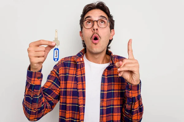 Young Hispanic Man Holding Home Keys Isolated White Background Pointing — Stock Photo, Image