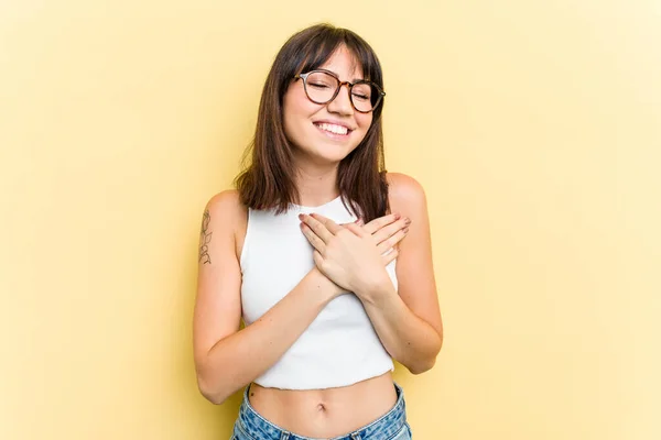 Young Caucasian Woman Isolated Yellow Background Laughing Keeping Hands Heart — Stock Photo, Image