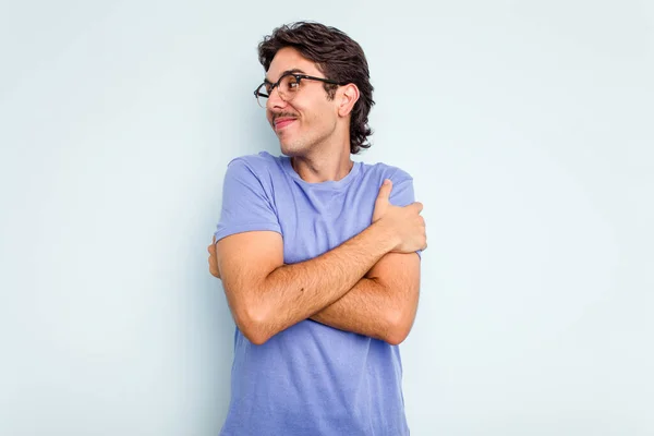 Young Hispanic Man Isolated Blue Background Hugs Smiling Carefree Happy — ストック写真