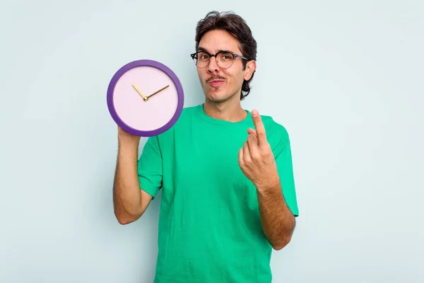 Young Hispanic Man Holding Clock Isolated White Background Pointing Finger — Stock Photo, Image