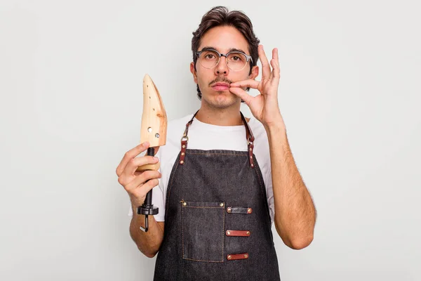 Young Hispanic Shoemaker Isolated White Background Fingers Lips Keeping Secret — Stock Photo, Image