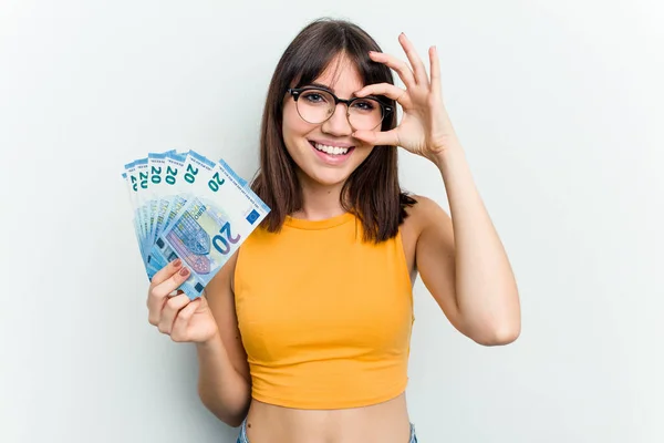 Young Caucasian Woman Holding Banknotes Isolated Blue Background Excited Keeping — Stock Photo, Image