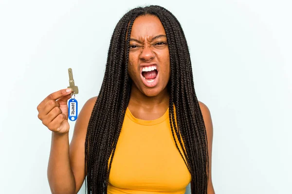 Young African American Woman Holding Home Keys Isolated Blue Background — Stock Photo, Image