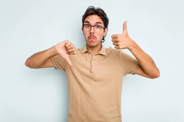 Young Hispanic Man Isolated Blue Background Showing Thumbs Thumbs Difficult — стоковое фото