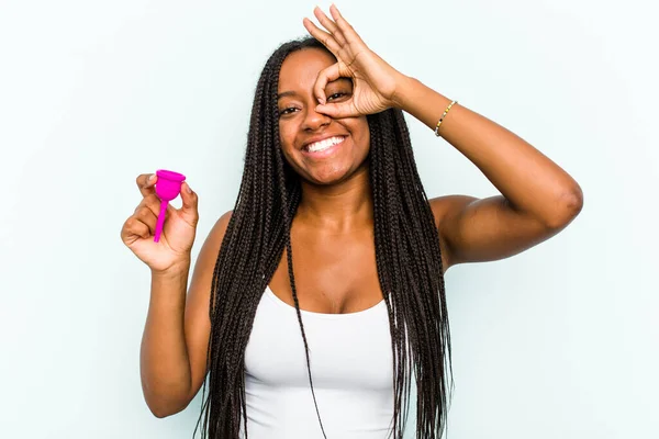 Young African American Woman Holding Menstrual Cup Isolated Blue Background — Stock Photo, Image