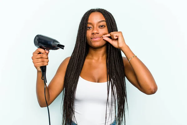 Young African American Woman Holding Hairdryer Isolated Blue Background Fingers — Stock Photo, Image