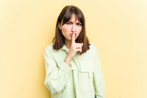 Young Caucasian Woman Isolated Yellow Background Keeping Secret Asking Silence — Stock Photo, Image