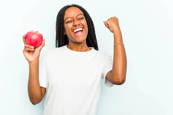 Young African American Woman Holding Apple Isolated Blue Background Raising — Stock Photo, Image