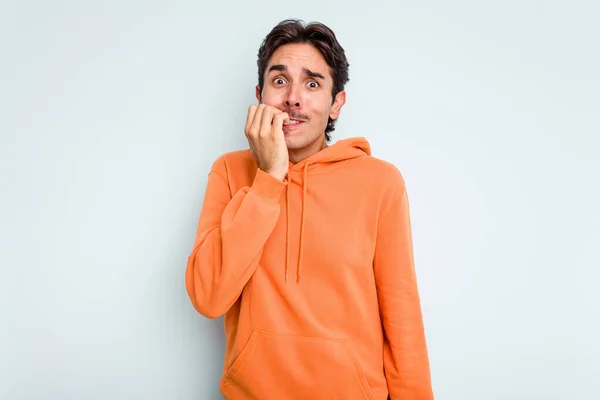 Young Hispanic Man Isolated Blue Background Biting Fingernails Nervous Very — Stock Photo, Image