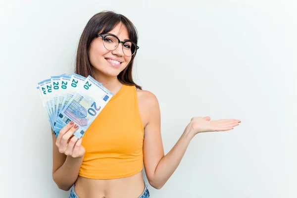 Young Caucasian Woman Holding Banknotes Isolated Blue Background Showing Copy — Stock Photo, Image