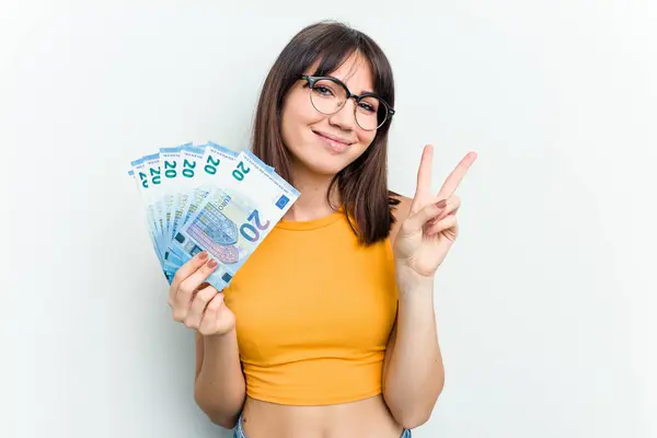 Young Caucasian Woman Holding Banknotes Isolated Blue Background Showing Number — Stock Photo, Image
