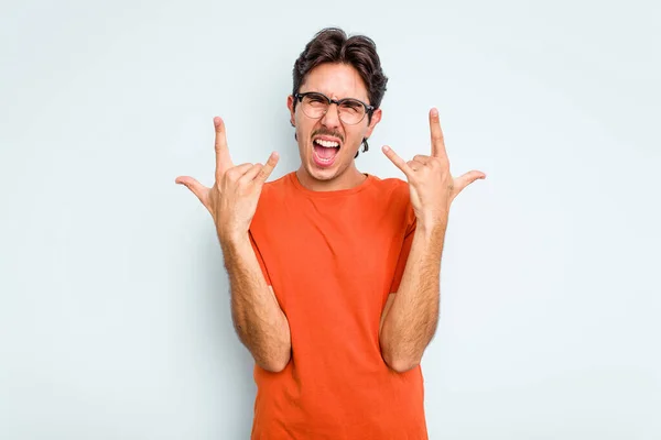 Young Hispanic Man Isolated Blue Background Showing Horns Gesture Revolution — ストック写真