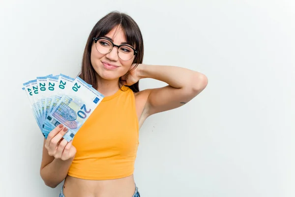 Young Caucasian Woman Holding Banknotes Isolated Blue Background Touching Back — Stock Photo, Image