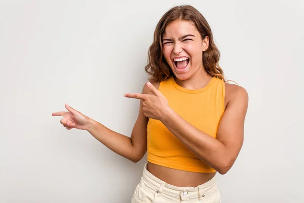 Young Caucasian Woman Isolated Blue Background Pointing Forefingers Copy Space — Stock Photo, Image
