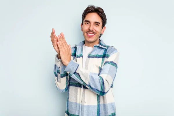 Young Hispanic Man Isolated Blue Background Feeling Energetic Comfortable Rubbing — стоковое фото