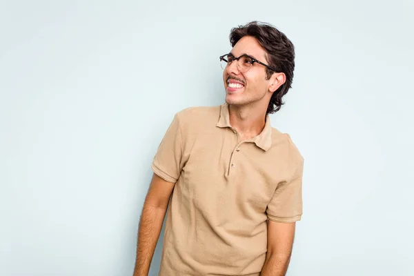 Young Hispanic Man Isolated Blue Background Relaxed Happy Laughing Neck — стоковое фото