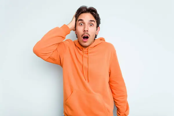 Young Hispanic Man Isolated Blue Background Being Shocked She Has — стоковое фото