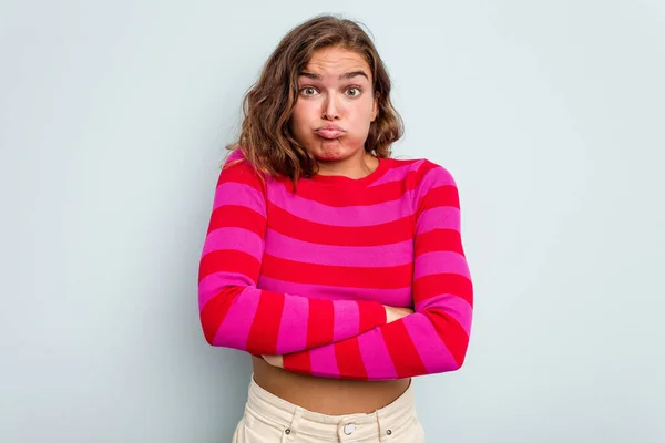 Young Caucasian Woman Isolated Blue Background Blows Cheeks Has Tired — Stock Photo, Image