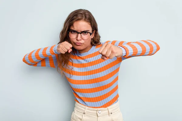 Young Caucasian Woman Isolated Blue Background Throwing Punch Anger Fighting — Stock Photo, Image