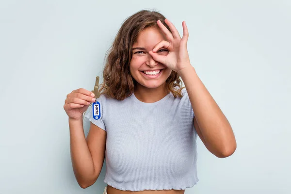 Young Caucasian Woman Holding Home Keys Isolated Blue Background Excited — Stock Fotó