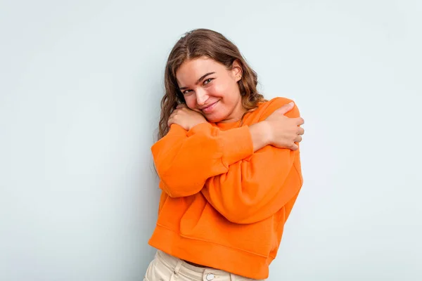 Young Caucasian Woman Isolated Blue Background Hugs Smiling Carefree Happy — Stock Photo, Image