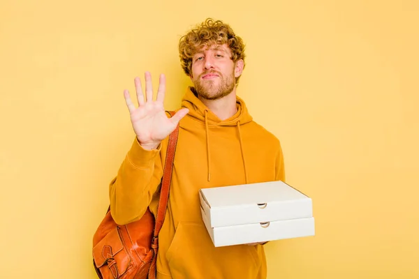 Young Student Man Holding Pizzas Isolated Yellow Background Smiling Cheerful — Stock Photo, Image