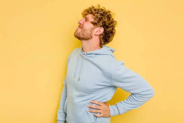 Young Caucasian Man Isolated Yellow Background Suffering Back Pain — Stock Photo, Image