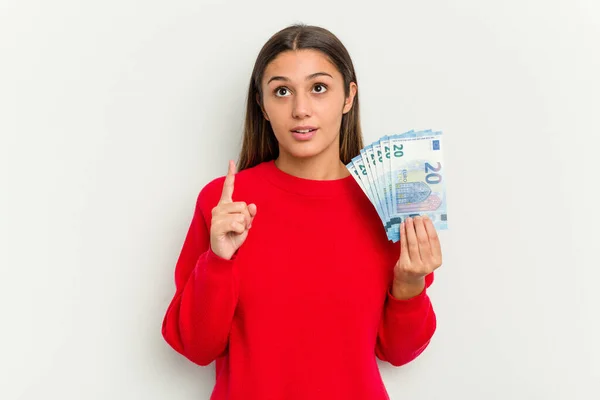 Young Indian Woman Holding Banknotes Isolated White Background Pointing Upside — Stock Photo, Image