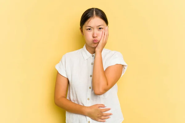 Young Asian Woman Isolated Yellow Background Blows Cheeks Has Tired — Stock Photo, Image