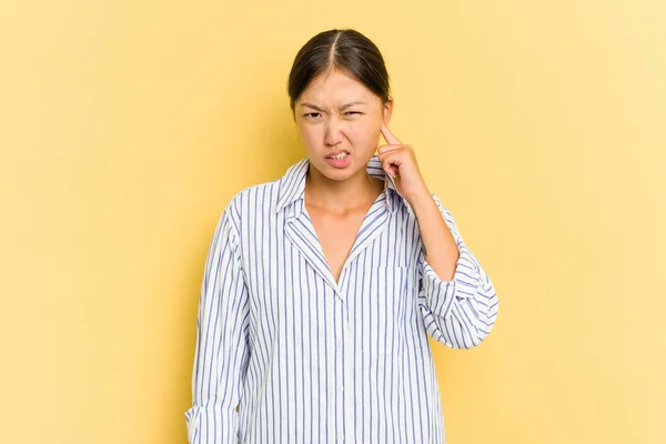 Young Asian Woman Isolated Yellow Background Covering Ears Fingers Stressed — Stock Photo, Image