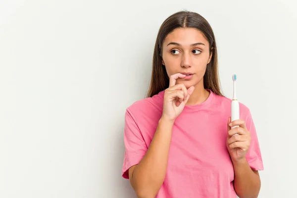 Young Indian Woman Brushing Teeth Isolated White Background Relaxed Thinking — Stock Photo, Image