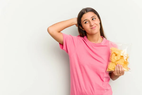 Young Indian Woman Holding Crips Isolated White Background Touching Back — Stock Photo, Image