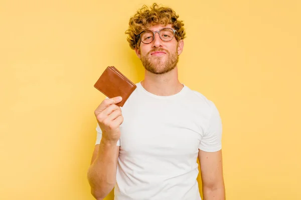 Young Caucasian Man Holding Wallet Isolated Yellow Background Happy Smiling — Stock Photo, Image