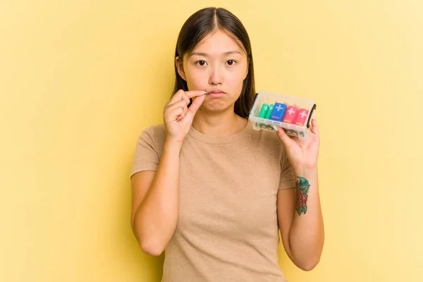 Young Asian Woman Holding Batteries Recycle Them Isolated Yellow Background — Stock Photo, Image