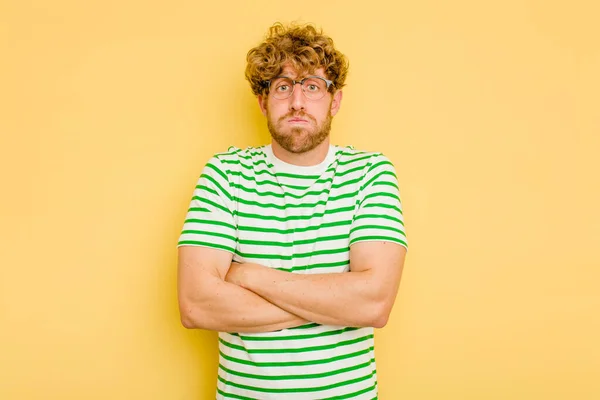 Young Caucasian Man Isolated Yellow Background Blows Cheeks Has Tired — Stock Photo, Image