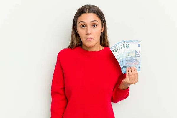 Young Indian Woman Holding Banknotes Isolated White Background Shrugs Shoulders — Stock Photo, Image