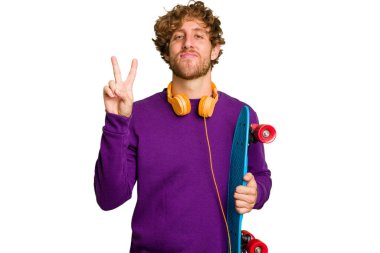 Young skater caucasian man isolated on white background showing number two with fingers.