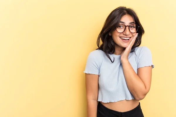 Young Indian Woman Isolated Yellow Background Shouts Loud Keeps Eyes — Stock Photo, Image