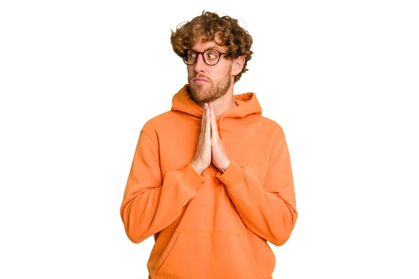 Young Caucasian Man Isolated Green Chroma Background Praying Showing Devotion — Stock Photo, Image