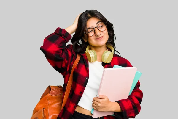 Young Student Indian Woman Wearing Headphones Isolated Touching Back Head — Stock Photo, Image