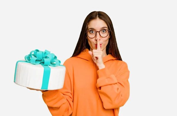 Young Caucasian Woman Holding Birthday Cake Isolated Keeping Secret Asking — Stock Photo, Image