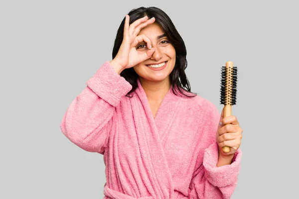 Young Indian Woman Bathrobe Holding Hairbrush Isolated Excited Keeping Gesture — Stock Photo, Image