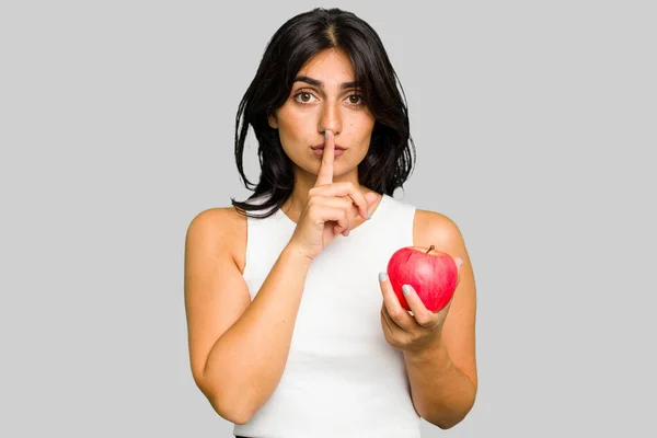 Young Indian Woman Holding Apple Healthy Lifestyle Isolated Keeping Secret — Stock Photo, Image